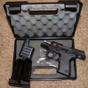 Taurus PT140 S&W 40cal with two 10 shot clips, speed loader and carrying case.