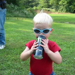 My son at a 2008 Wabash USPSA match.  He loves Monster soda, but he didn't sleep for 3 days... (Just kidding, the can was empty!)