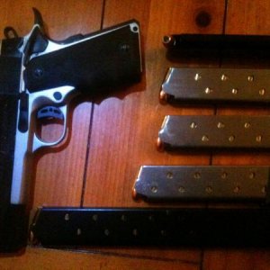 ria 1911 tachtical with hogue grip and some nice clips