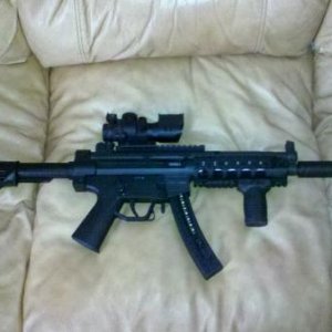 GSG 522 with rrages aluminum quad rail, m4 stock, 4x reticle, and tapco grip