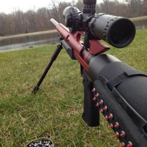 Airforce Condor 6.35mm (.25 cal) w/ barrel shroud. Scope is a Hawke Sidewinder 30 Tactical 6.5-20x42mm 20x1/2 mildot reticle. Rifle is powered by a 49