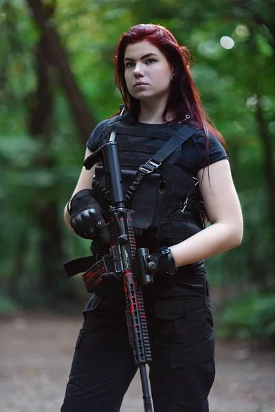 depositphotos_205402692-stock-photo-portrait-girl-red-hair-rifle.jpg