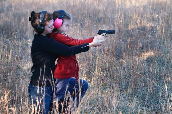 Women-teaching-girl-to-shoot-pistol-e1511994578457.png