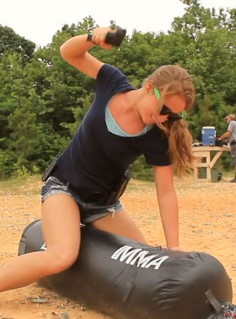 Cory-And-Erica-Punching-Bag-Glock-Beating.jpg