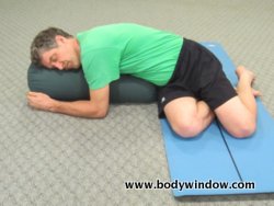 xside-lying-right-with-yoga-bolster.jpg.pagespeed.ic.79x_F7553f.jpg